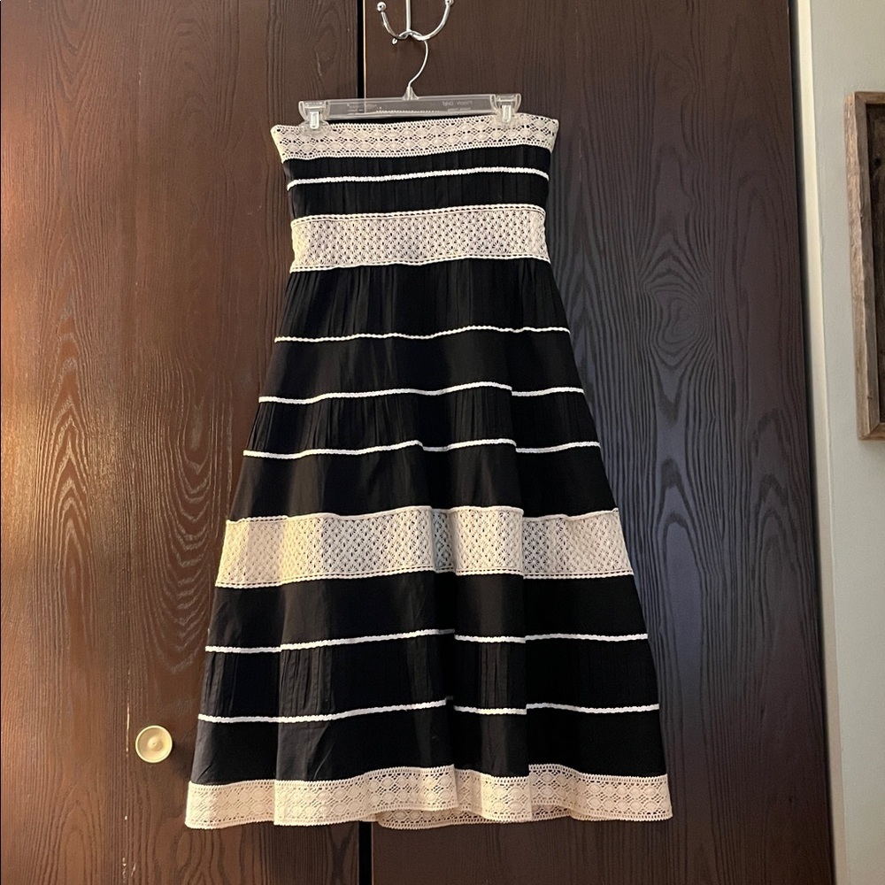Ann Taylor strapless black dress with cream colored trim. Midi. Size 4